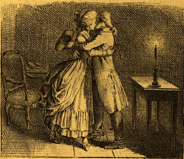 Couple_embraces_candlelight