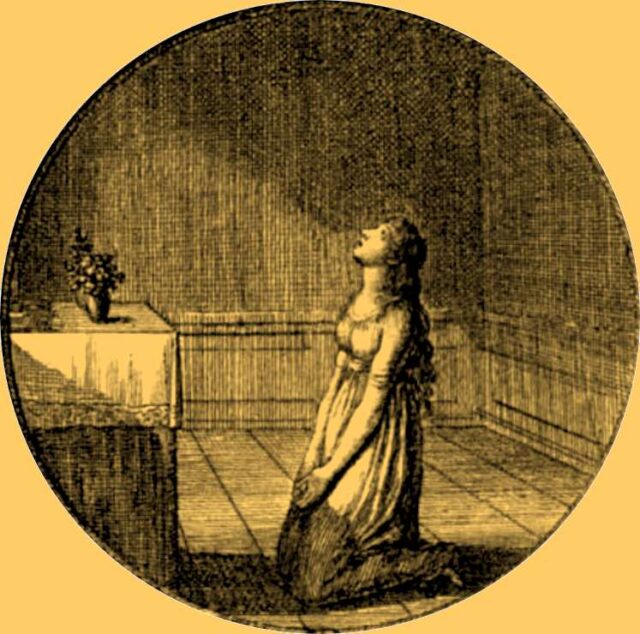 Young_woman_prays_kneeling